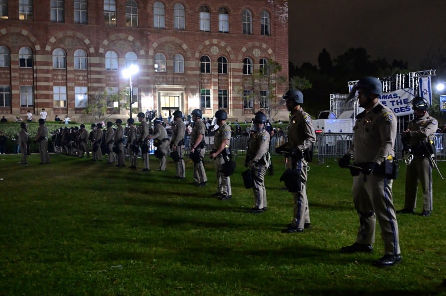 US Police officers stand guard after clashes erupted on the campus of the University of California Los Angeles (UCLA), in Los Angeles on May 1, 2024. Clashes broke out on May 1, 2024 around pro-Palestinian demonstrations at the University of California, Los Angeles, as universities around the United States struggle to contain similar protests on dozens of campuses. (Photo by Frederic J. Brown / AFP) (Photo by FREDERIC J. BROWN/AFP via Getty Images)