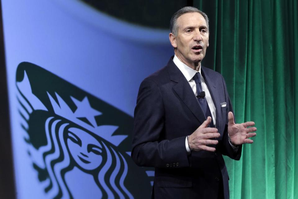FILE- In this Dec. 7, 2016, file photo, Starbucks Chairman and CEO Howard Schultz speaks during the Starbucks 2016 Investor Day meeting in New York. Starbucks says it will hire 10,000 refugees over the next five years, a response to President Donald Trump's indefinite suspension of Syrian refugees and temporary travel bans that apply to six other Muslim-majority nations. Schultz said in a letter to employees Sunday, Jan. 29, 2017, that the hiring would apply to stores worldwide. (AP Photo/Richard Drew, File)
