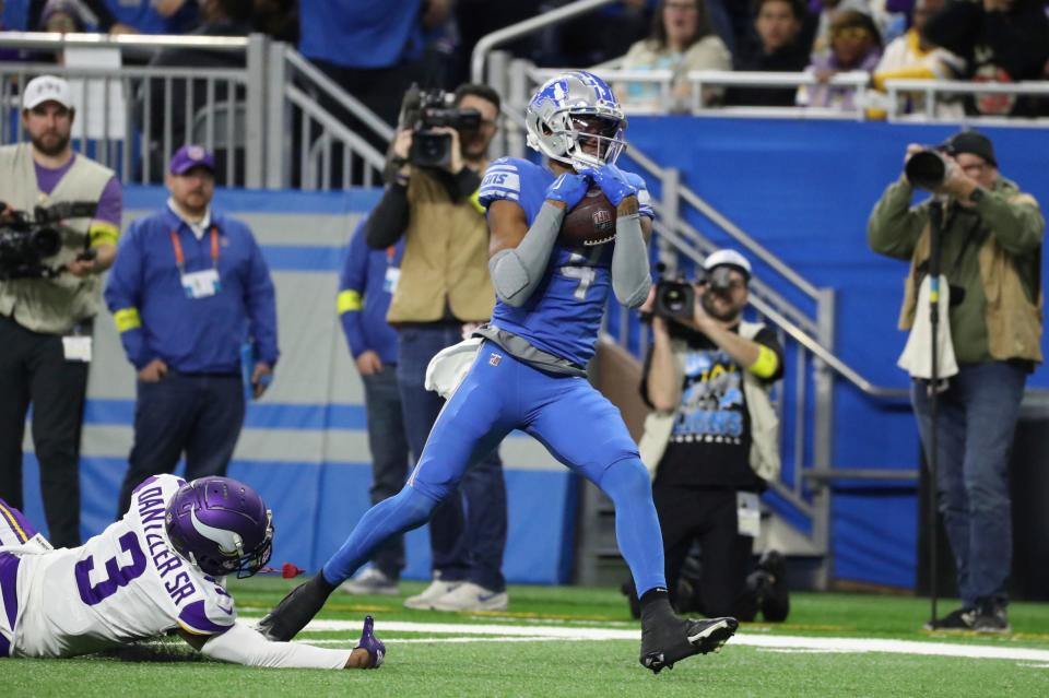 Lions wide receiver DJ Chark catches a touchdown pass against Vikings cornerback Cameron Dantzler Sr. during the first half on Sunday, Dec. 11, 2022, at Ford Field.