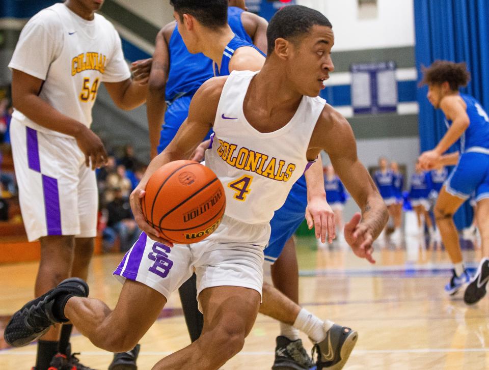 Clay's Ameer Harris (4) during the Marian vs. Clay boys sectional semifinal game Friday, March 4, 2022 at Marian High School. 