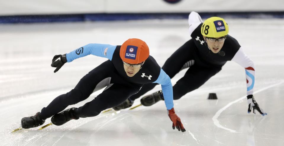 J.R. Celski, left, and Kyle Carr, right, competes in the men's 1,500 meters during the U.S. Olympic short track trials, Friday, Jan. 3, 2014, in Kearns, Utah. (AP Photo/Rick Bowmer)