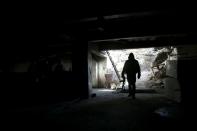 A rebel fighter in a tunnel on the outskirts of the Syrian capital Damascus on January 29, 2016