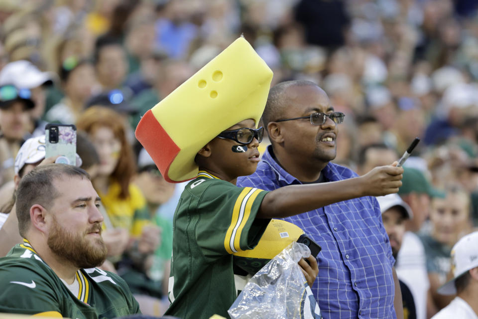 Fans watch warmups before a preseason NFL football game between the Green Bay Packers and the New Orleans Saints Friday, Aug. 19, 2022, in <a class="link " href="https://sports.yahoo.com/nfl/teams/green-bay/" data-i13n="sec:content-canvas;subsec:anchor_text;elm:context_link" data-ylk="slk:Green Bay;sec:content-canvas;subsec:anchor_text;elm:context_link;itc:0">Green Bay</a>, Wis. (AP Photo/Mike Roemer)