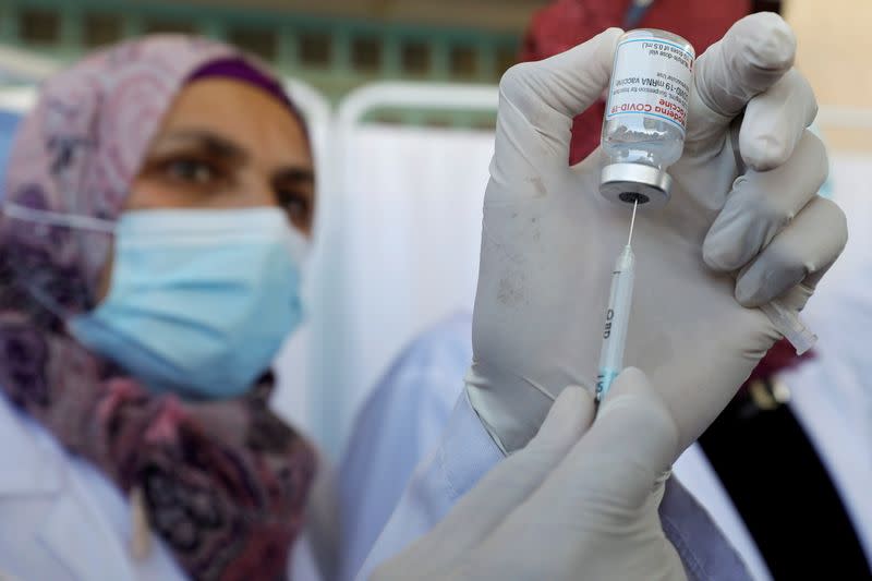 FILE PHOTO: Palestinian health workers are vaccinated against COVID-19 in Bethlehem