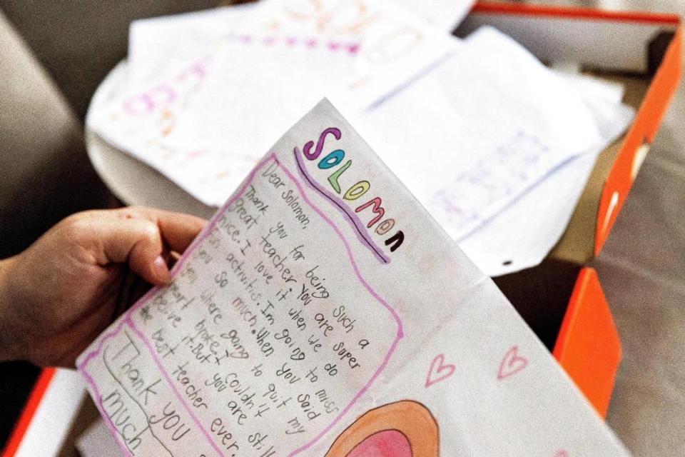 Nicolette Solomon looks through letters and notes from her former students.