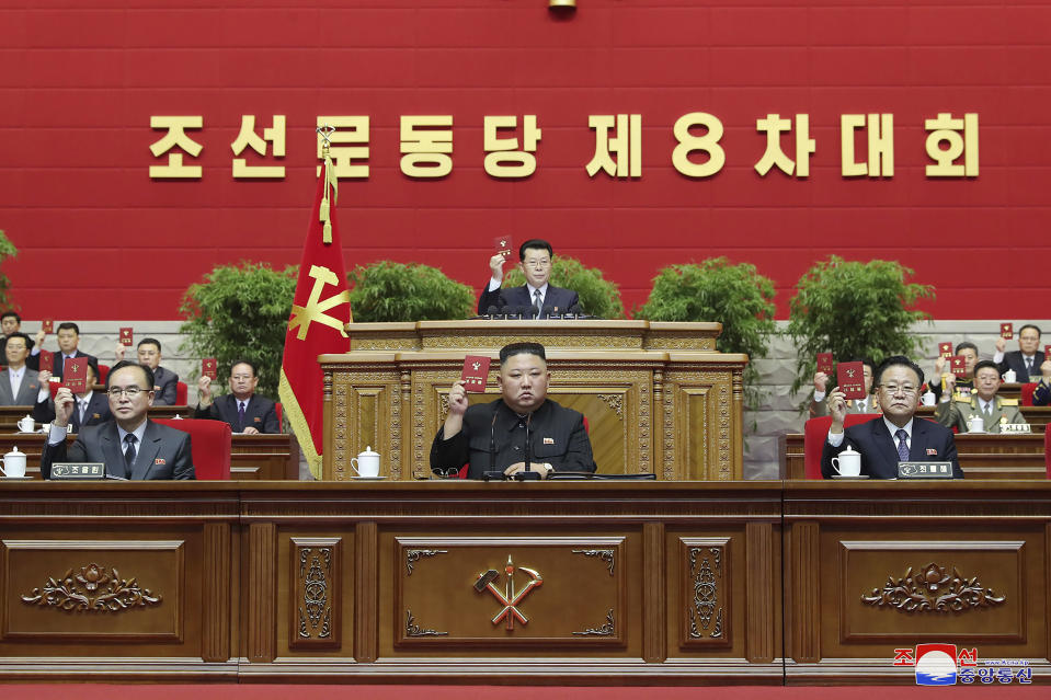 In this photo provided by the North Korean government, North Korean leader Kim Jong Un, bottom center, attends a ruling party congress in Pyongyang, North Korea Tuesday, Jan. 12, 2021. Kim vowed all-out efforts to bolster his country's nuclear deterrent during the major ruling party meeting where he earlier laid out plans to work toward salvaging the broken economy. Independent journalists were not given access to cover the event depicted in this image distributed by the North Korean government. The content of this image is as provided and cannot be independently verified. Korean language watermark on image as provided by source reads: "KCNA" which is the abbreviation for Korean Central News Agency. (Korean Central News Agency/Korea News Service via AP)