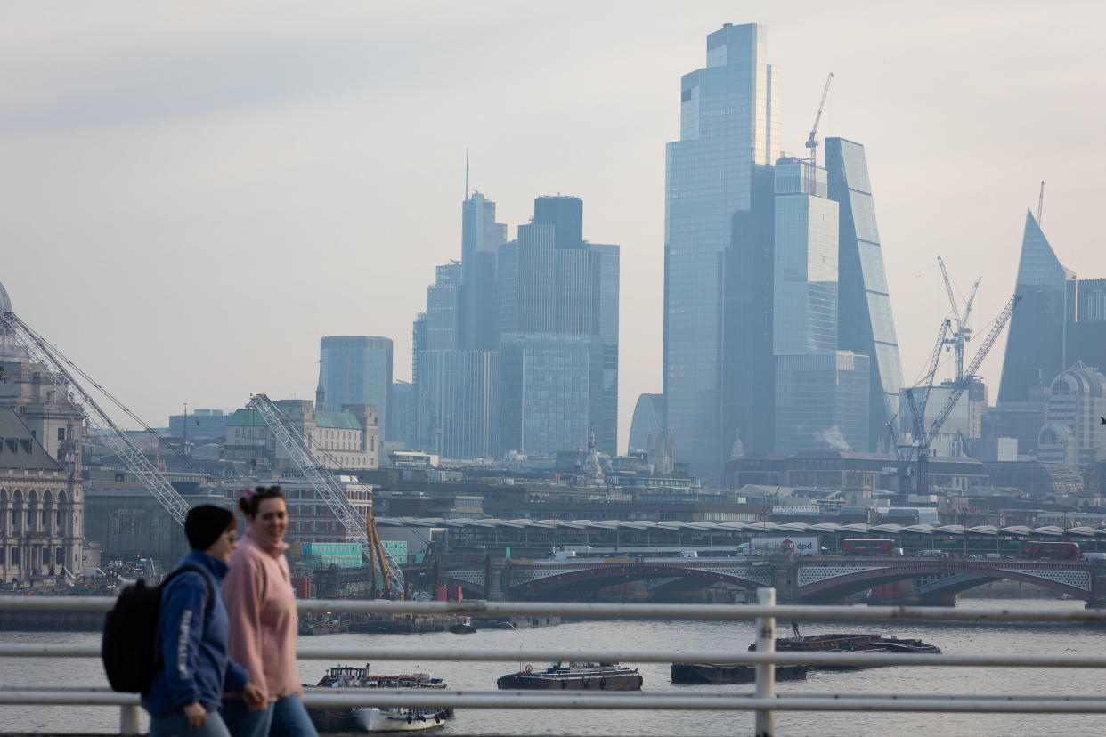 FTSE  LONDON, UNITED KINGDOM - 2023/02/15: Commuters cross Waterloo Bridge with London's financial district in the background. Consumer Price Index (CPI) Inflation has reduced today to 10.1%, faster than expected, according to the Office for National Statistics, though it remains close to a 40-year high. (Photo by Tejas Sandhu/SOPA Images/LightRocket via Getty Images)