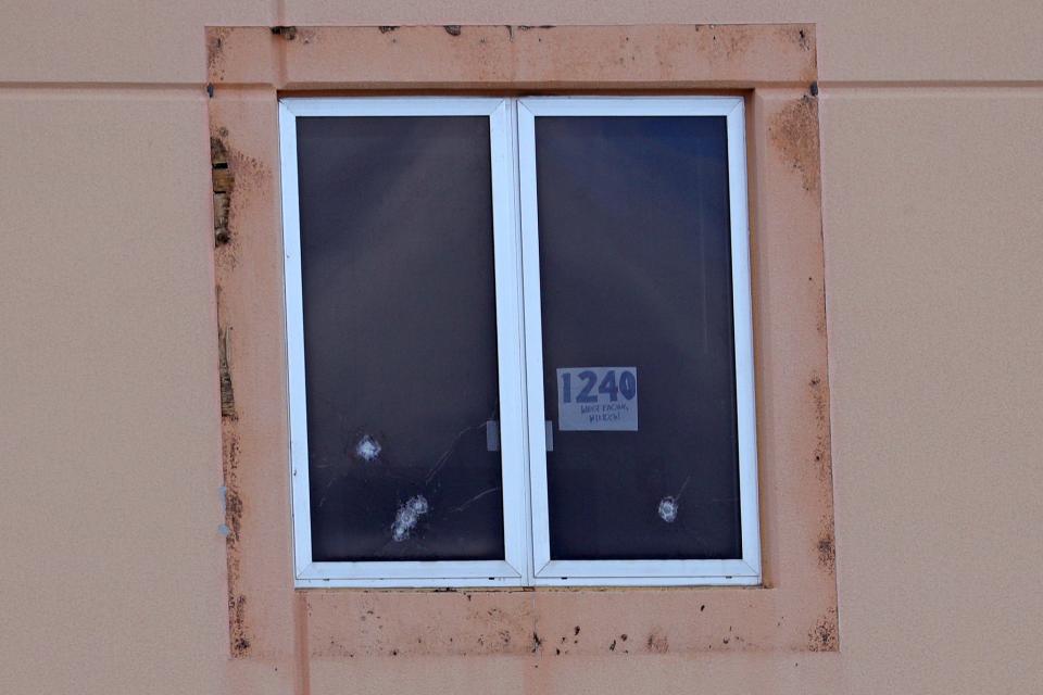 A sign reading “1240 west facing window” and five bullet holes can be seen on Thursday, August 4, 2022 in a third floor window of the “1200 building,” the crime scene where the 2018 shootings took place, at Marjory Stoneman Douglas High School in Parkland.