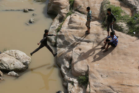 Iraqi youths enjoy their Friday holiday at Shallalat district (Arabic for "waterfalls") in eastern Mosul, Iraq, April 21, 2017. REUTERS/ Muhammad Hamed