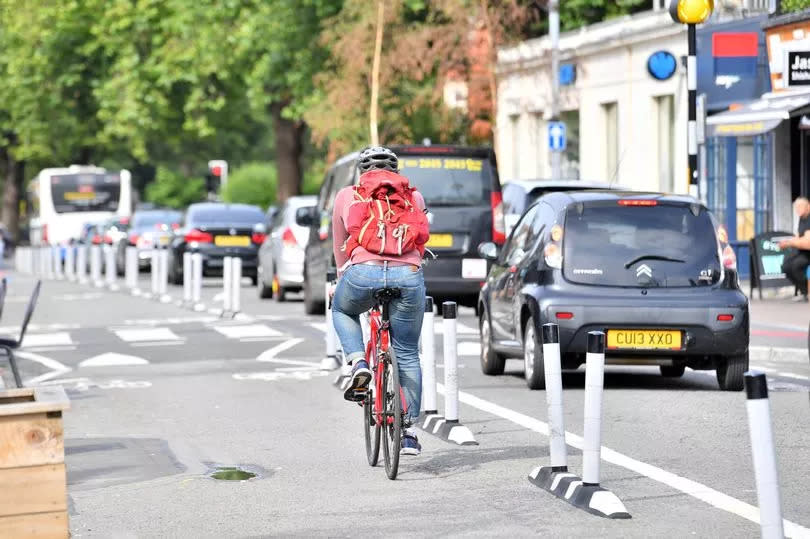 A cyclisit going down Wellfield Road in Cardiff