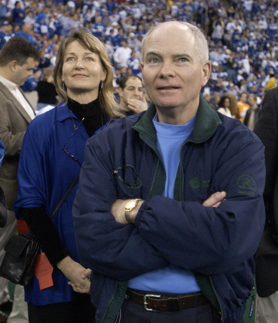 FILE - In this Jan. 9, 2005 file photo, Indiana Gov. Joe Kernan, right, and Lt. Gov. Kathy Davis wait for the start of the AFC wild-card game against the Denver Broncos in Indianapolis. Kernan has died at age 74. His governor's office chief of staff says Kernan died early Wednesday, July 29, 2020 at a South Bend health care facility. (AP Photo/Darron Cummings, File)