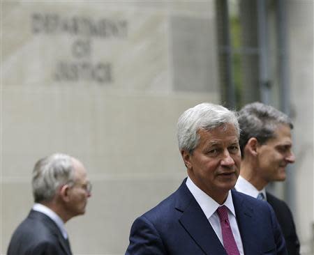 J.P. Morgan CEO Jamie Dimon (front) leaves the U.S. Justice Department after meeting with Attorney General Eric Holder, in Washington September 26, 2013. REUTERS/Gary Cameron