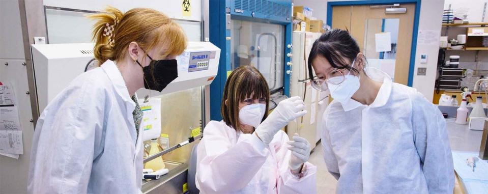 Nora Sun (right) observes and assists in recent lab research. The 17-year-old has held numerous chemistry research internships and has formed nonprofits to help increase girls' access to STEM careers.