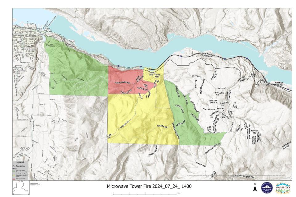 A map shows evacuations and closures for the Microwave Tower Fire.