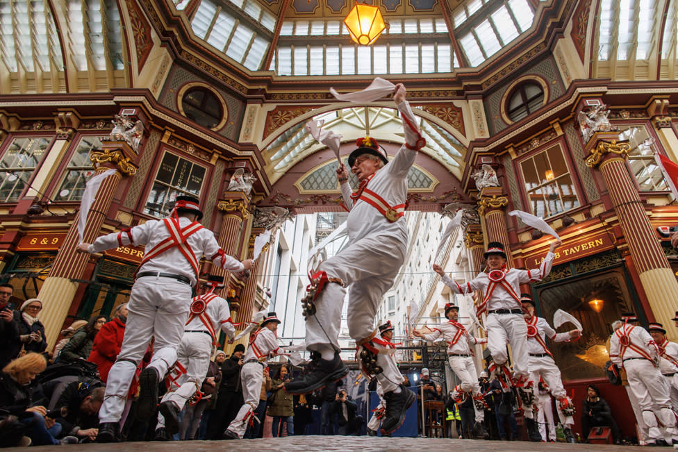 Members of Ewell St. Mary's Morris Men dancing team perform Morris dance at Leadenhall Market to celebrate St George's Day in London, Britain, 23 April 2024.