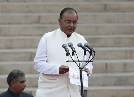 Arun Jaitley is administered oath of office by India's President Pranab Mukherjee (unseen) as a cabinet minister at the presidential palace in New Delhi May 26, 2014. REUTERS/Adnan Abidi/Files