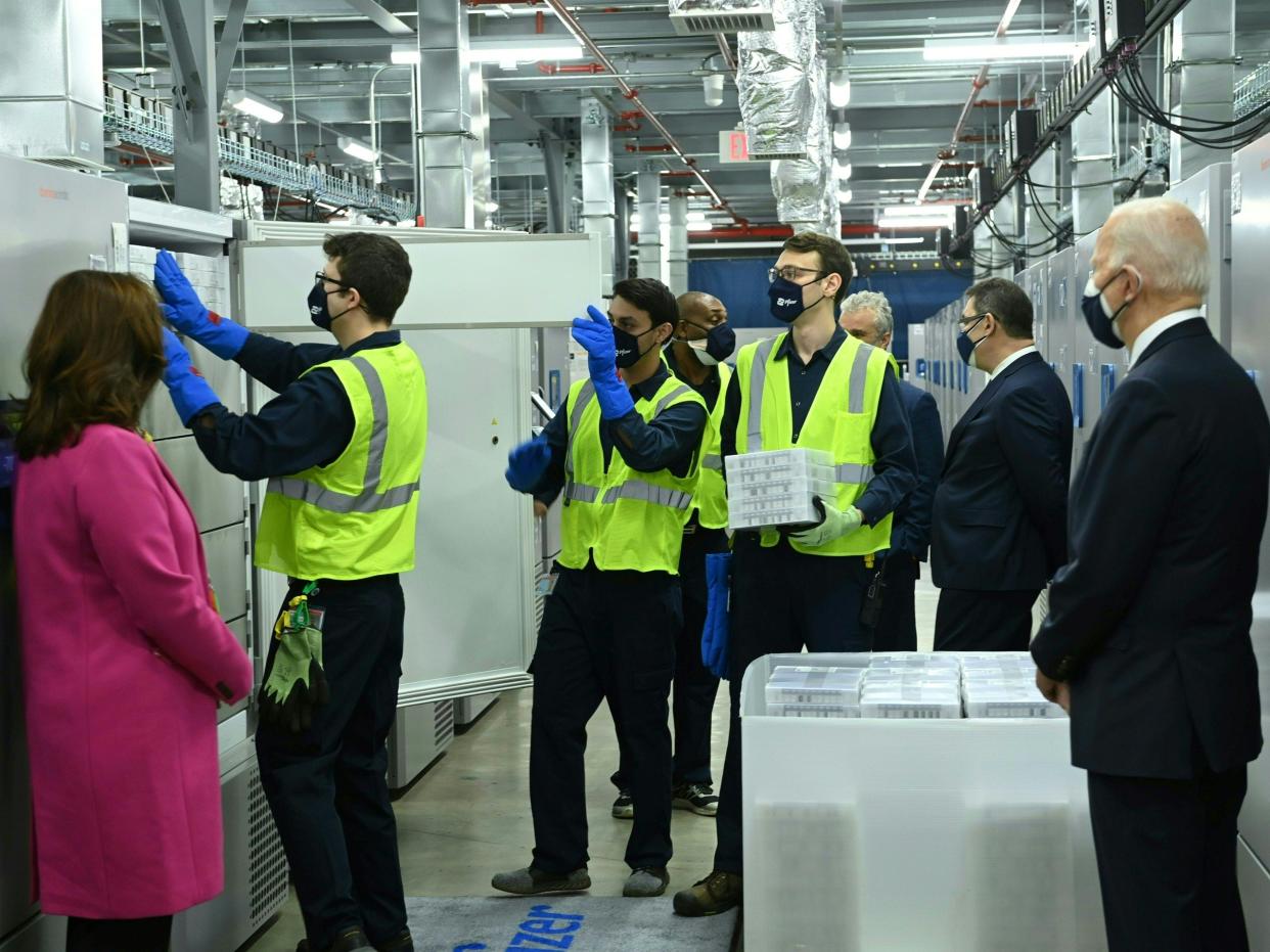 Joe Biden and Michigan Governor Gretchen Whitmer tours vaccine freezers on February 19, 2021, in Kalamazoo, Michigan.  (AFP via Getty Images)