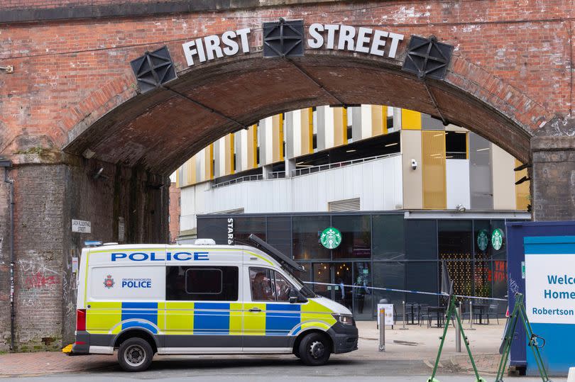 A police scene close to First Street in Manchester city centre