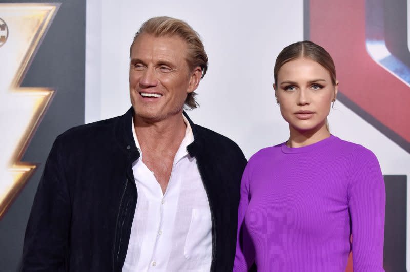 Dolph Lundgren, seen with his daughter Ida, has a new movie and game show out this week. File Photo by Chris Chew/UPI