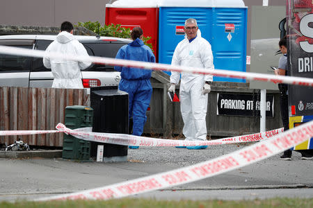 Investigators at the site of Friday's shooting outside the Linwood Mosque in Christchurch, New Zealand March 18, 2019. REUTERS/Edgar Su