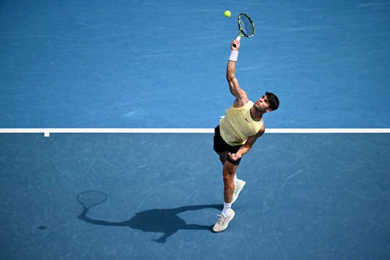Spanish tennis player Carlos Alcaraz in action against China's Juncheng Shang during their men's singles third round tennis match of the 2024 Australian Open at Melbourne Park. Joel Carrett/AAP/dpa