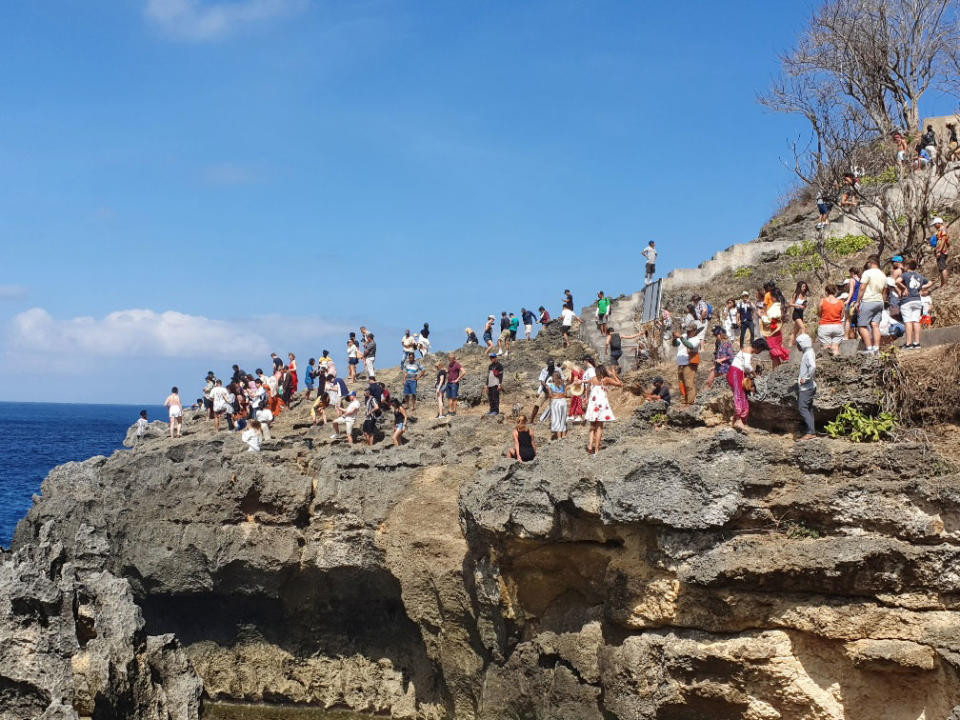 Crowds on rock in Nusa Penida