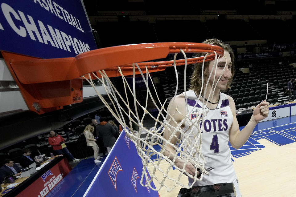 College of Idaho forward Tyler Robinett celebrates after the NAIA men's national championship college basketball game against Indiana Tech Saturday, March 18, 2023, in Kansas City, Mo. College of Idaho won 73-71. (AP Photo/Charlie Riedel)