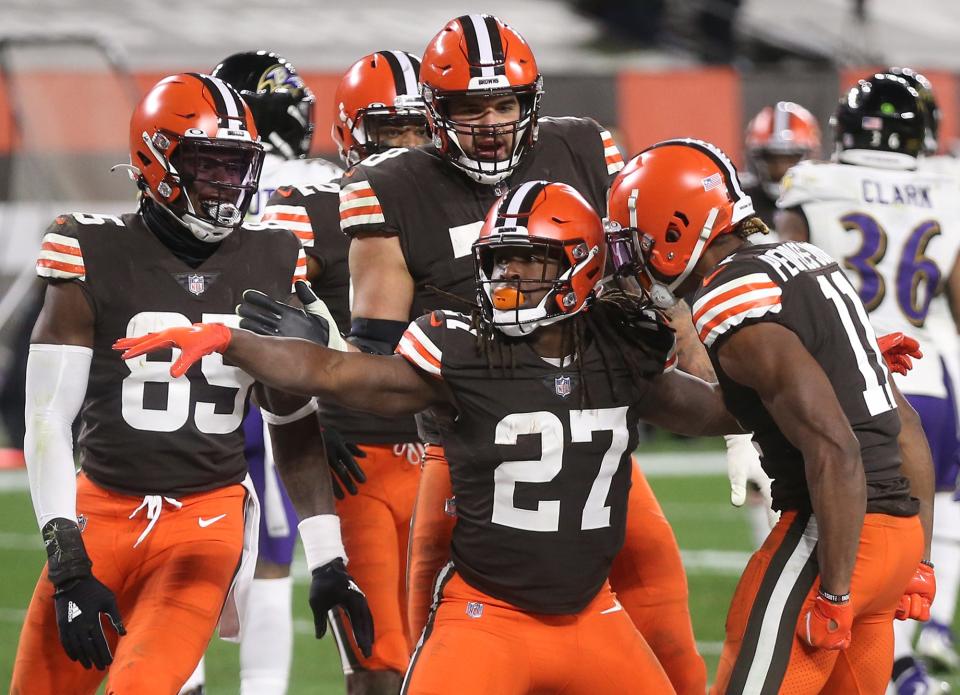 Browns running back Kareem Hunt (27) celebrates with teammates after scoring during the second half against the Baltimore Ravens, Monday, Dec. 14, 2020, in Cleveland, Ohio. [Jeff Lange/Beacon Journal]