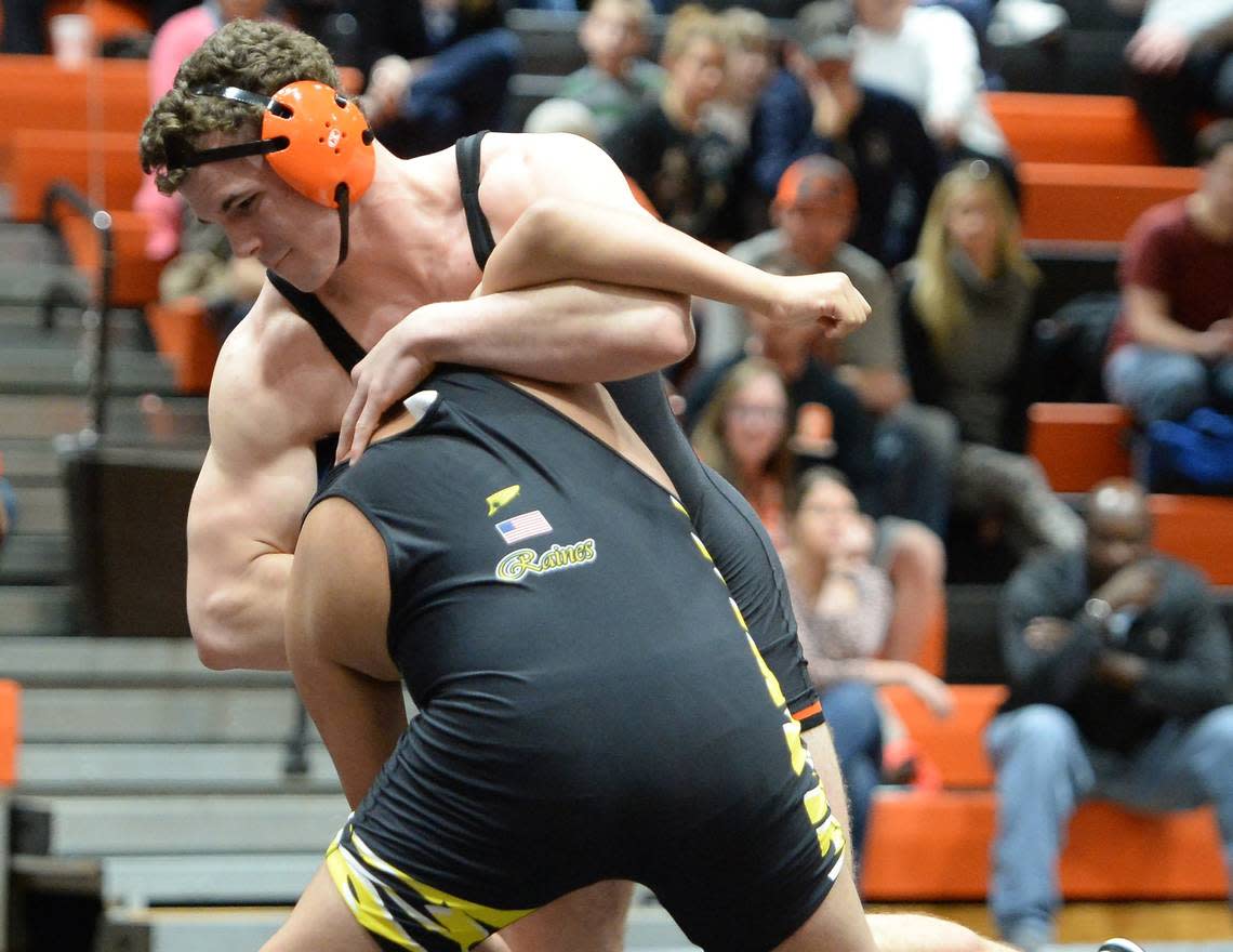 Payton Wilson, top, of Orange wrestles Daniel Gonzalez of Chapel Hill during a match in Hillsborough in January 2017.