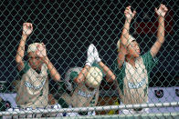 Taiwan's Chen Yu-Ting, left, Chen Yu-Ting and Shih Yi-Hung, right, watch from the dugout during the sixth inning of the International Championship baseball game against Curacao at the Little League World Series tournament in South Williamsport, Pa., Saturday, Aug. 27, 2022. Curacao won 1-0. (AP Photo/Tom E. Puskar)