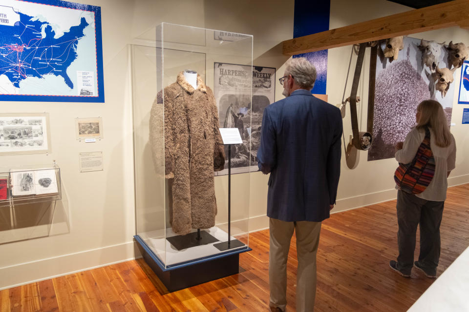 Canyon Mayor Gary Hinders explores the new Panhandle Plains Historical Museum exhibit "The Fall and Rise of an American Icon" Wednesday at the opening reception.