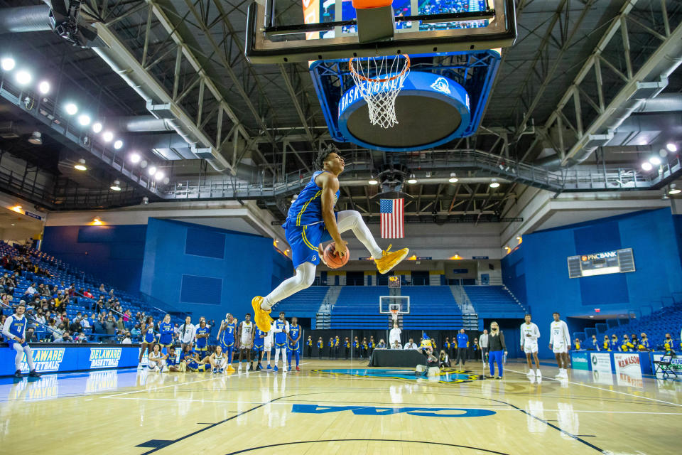 Jameer Nelson Jr. flies in for a dunk during Delaware's preseason hoopla event at the Carpenter Center.