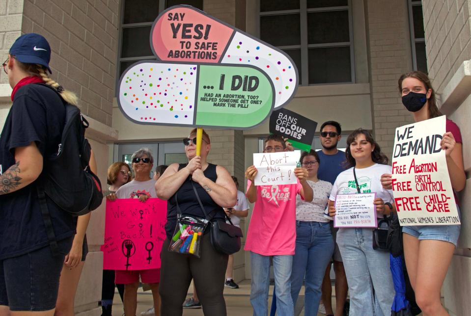 Protestors gather outside of the Alachua County Courthouse to protest the overturning of Roe v. Wade in Gainesville, Fla. on Saturday, June 25, 2022.