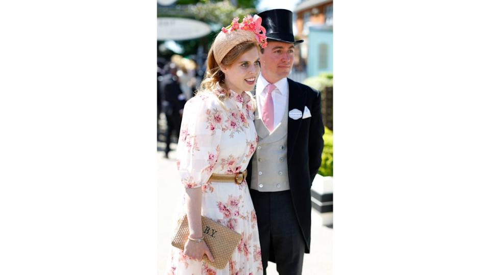 Princess Beatrice wearing a floral headband and dress with husband