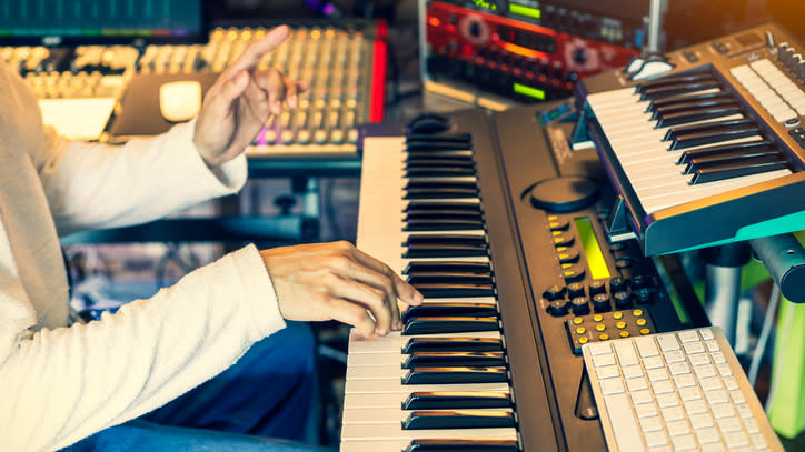  Man composing on a keyboard 