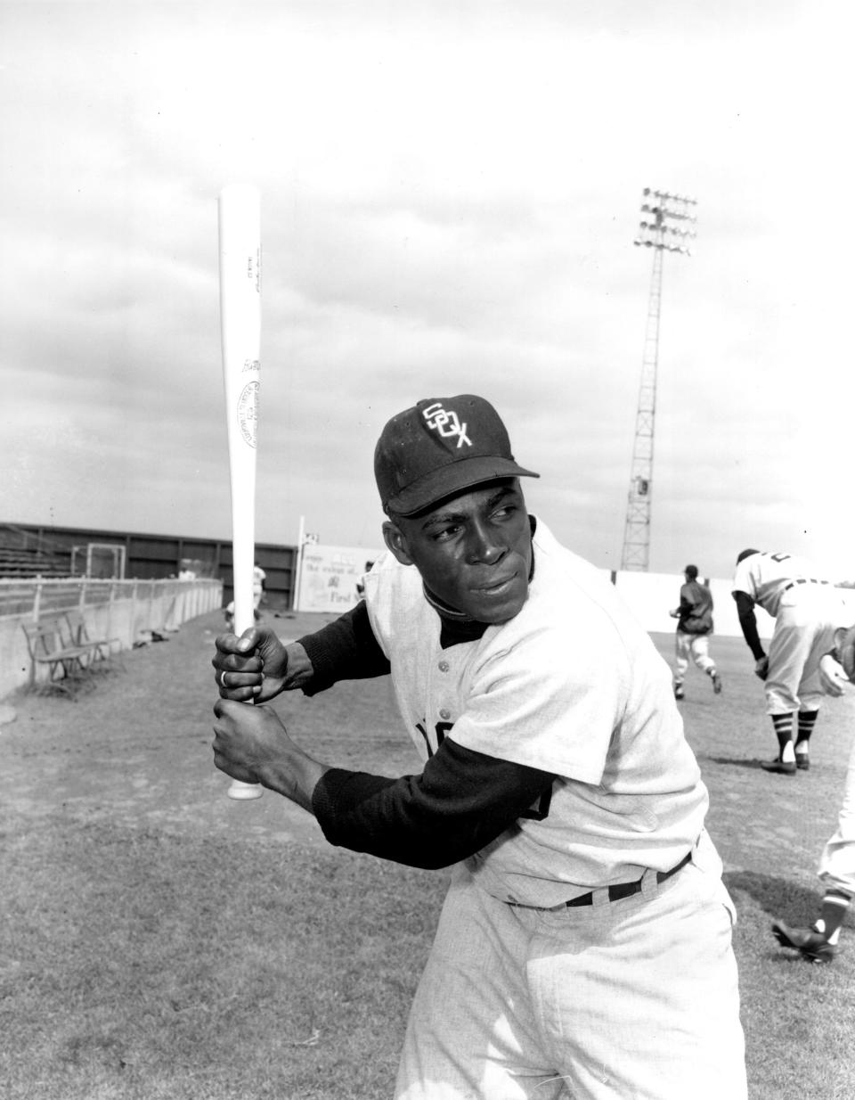 In this 1957 file photo, Chicago White Sox outfielder Orestes "Minnie" Minoso poses at Al Lopez Field in Tampa, Fla.