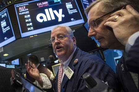 Citi Traders Thomas Ferrigno (L ) and Christopher Fuchs await the IPO of Ally Financial on the floor of the New York Stock Exchange April 10, 2014. EUTERS/Brendan McDermid