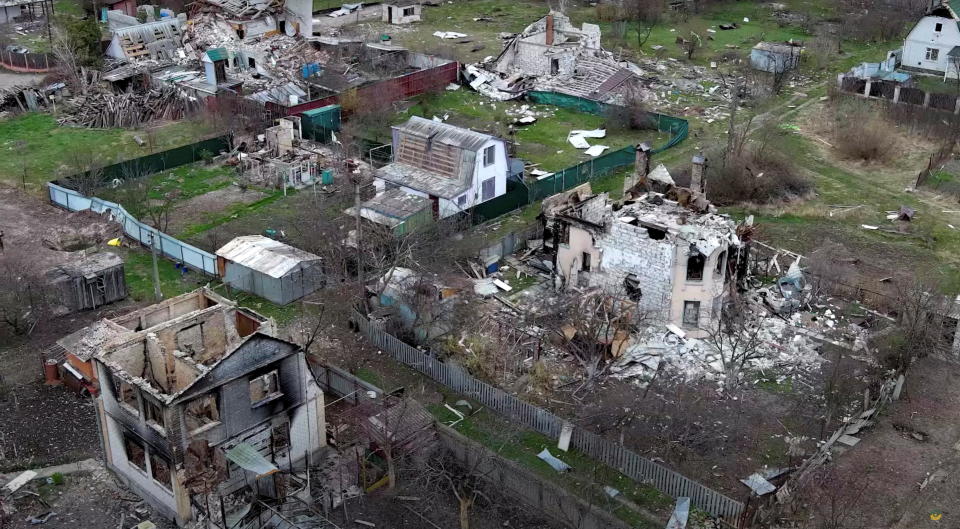 A general view shows damaged houses, amid Russia's invasion, in Moshchun village, Kyiv region, Ukraine in this still image taken from a drone video released April 22, 2022. Ukrainian military  / Credit: UKRAINIAN MILITARY TV via Reuters