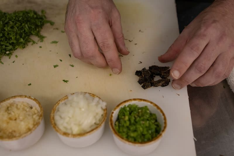 Chef Tobias Padovano prepares cicadas tacos at Cocina on Market restaurant, as Brood X or Brood 10 cicadas have begun emerging from the earth after 17 years, in Leesburg, Virginia U.S.