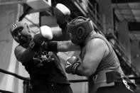 <p>Marco Padilla, right, lands a blow off the protective gear of Edgar Duncan at the “Bronx Tough Turkey Tussle” in the Hunts Point section of the Bronx, New York, on Nov. 16, 2017. (Photo: Gordon Donovan/Yahoo News) </p>