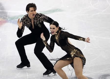 Figure Skating - Pyeongchang 2018 Winter Olympics - Ice Dance short dance competition - Gangneung Ice Arena - Gangneung, South Korea - February 19, 2018 - Tessa Virtue and Scott Moir of Canada perform. REUTERS/Damir Sagolj