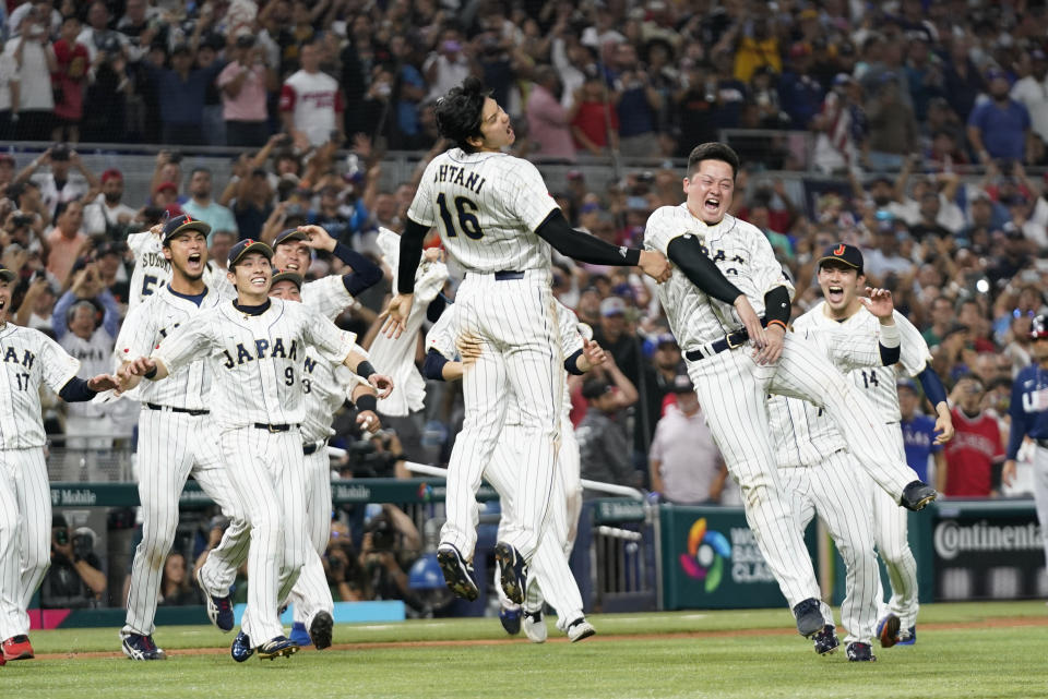 Japan players celebrate after defeating the United States in the World Baseball Classic championship game, Tuesday, March 21, 2023, in Miami. (AP Photo/Wilfredo Lee)