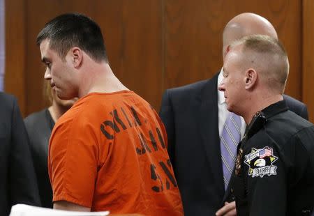 Former Oklahoma City police officer Daniel Holtzclaw (L), is led out of the courtroom after his sentencing in Oklahoma City, Oklahoma, January 21, 2016. REUTERS/Sue Ogrocki/Pool