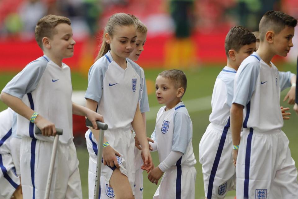 Bradley with other mascots before the World Cup qualifier match in March. (REUTERS)