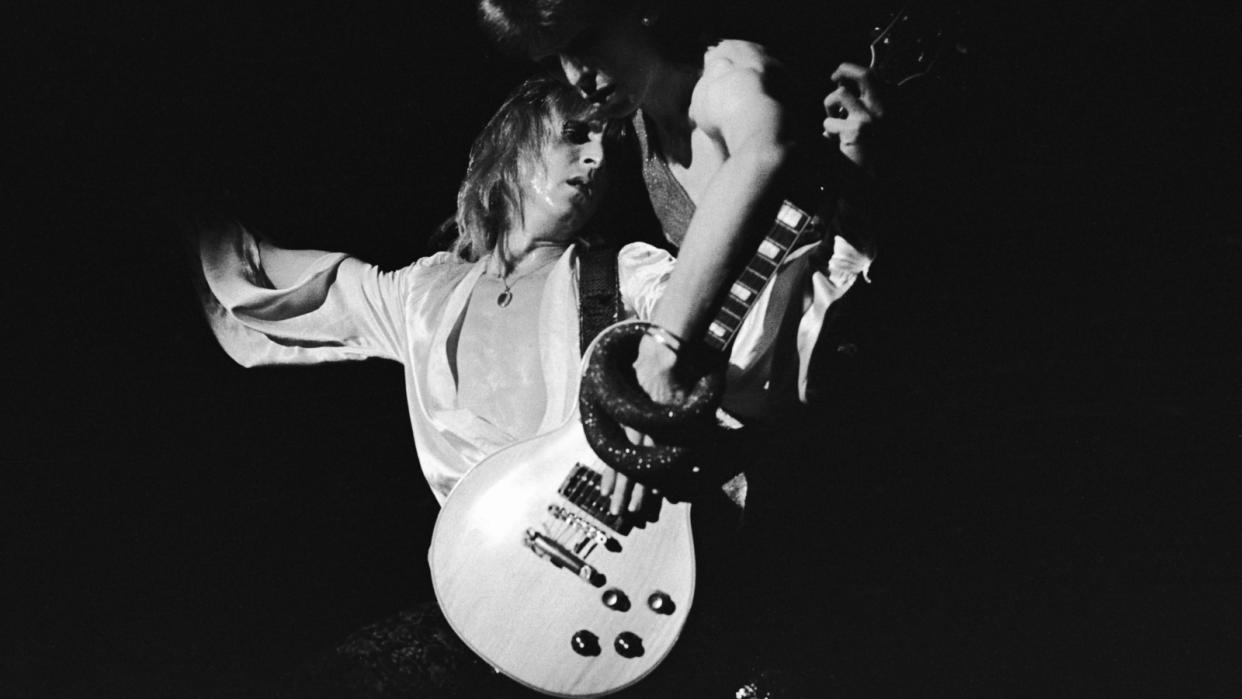  David Bowie (1947-2016) and guitarist Mick Ronson (1945-1993) perform during Bowie's last appearance as Ziggy Stardust at the Hammersmith Odeon, London, on July 3, 1973.  