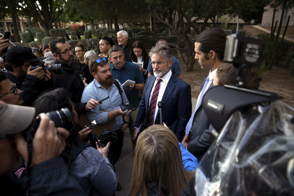 Scott Warren's attorney, Greg Kuykendall talks with media outside the Federal Courthouse after Warren's trial , Wednesday, Nov. 20, 2019 in Tucson, Ariz. Warren was acquitted Wednesday on charges he illegally harbored two Central American immigrants at a camp in southern Arizona operated by a humanitarian group. (Josh Galemore/Arizona Daily Star via AP)