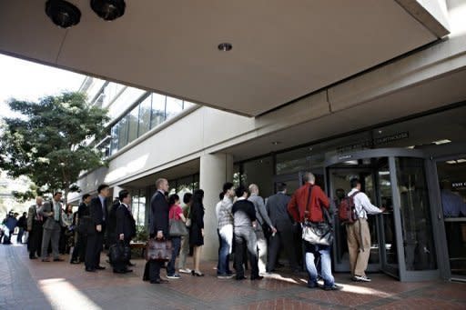 Individuals line up to enter the United States Courthouse in San Jose, California, to watch Apple and Samsung face each other in a patent infringement case on July 30. Lawyers for Apple and Samsung debated the differences between copying and honest competition as opening arguments were held Tuesday in a huge patent trial involving the two tech giants