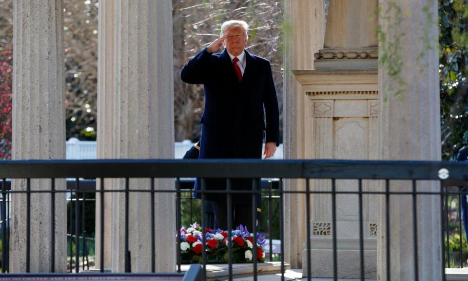 Donald Trump salutes after laying a wreath at the Hermitage, the home of Andrew Jackson, in Nashville, Tennessee.