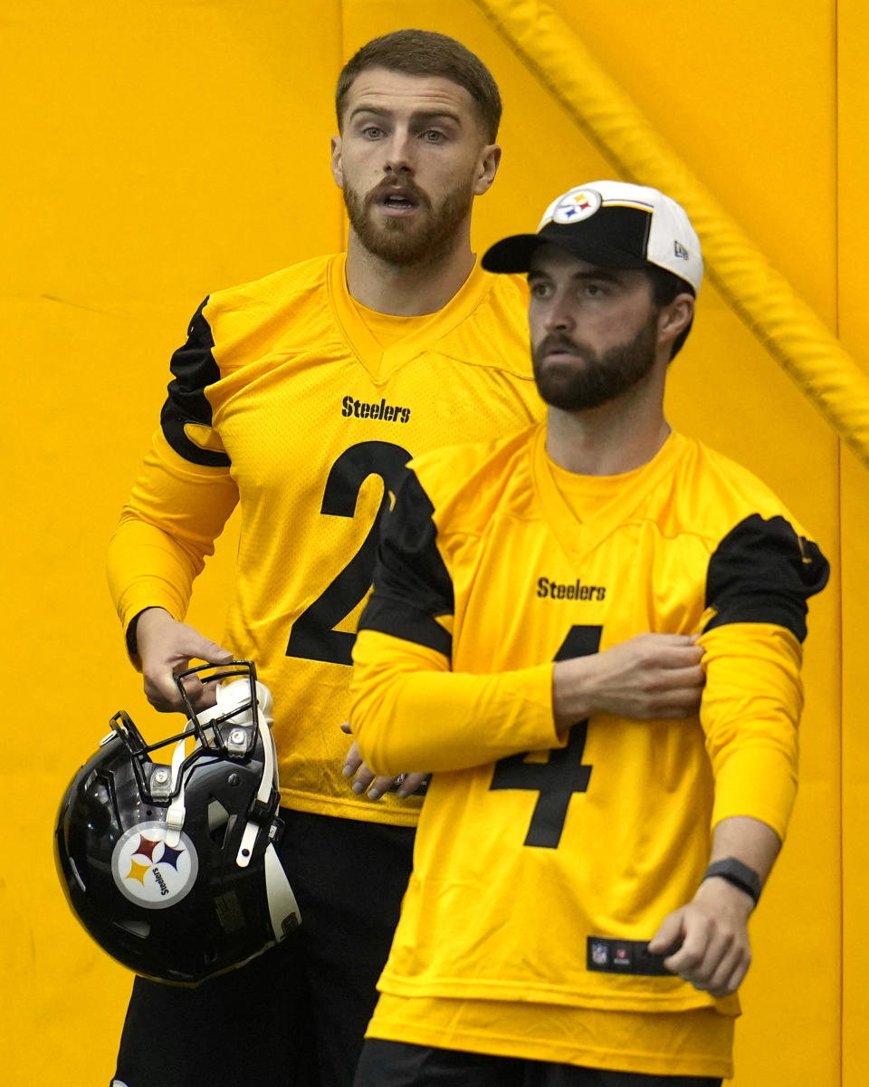 Tryout kickers Mark Jackson, left, and Caleb Shudak listen to instructions during the Pittsburgh Steeler's NFL rookie minicamp football practice in Pittsburgh, Friday, May 10, 2024. (AP Photo/Gene J. Puskar)