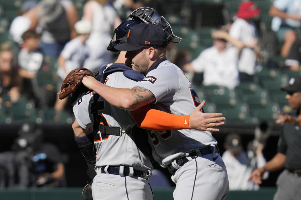 Detroit Tigers relief pitcher Alex Lange, right, celebrates with catcher Carson Kelly after the Tigers defeated the Chicago White Sox, 3-2, in a baseball game in Chicago, Sunday, Sept. 3, 2023. (AP Photo/Nam Y. Huh)